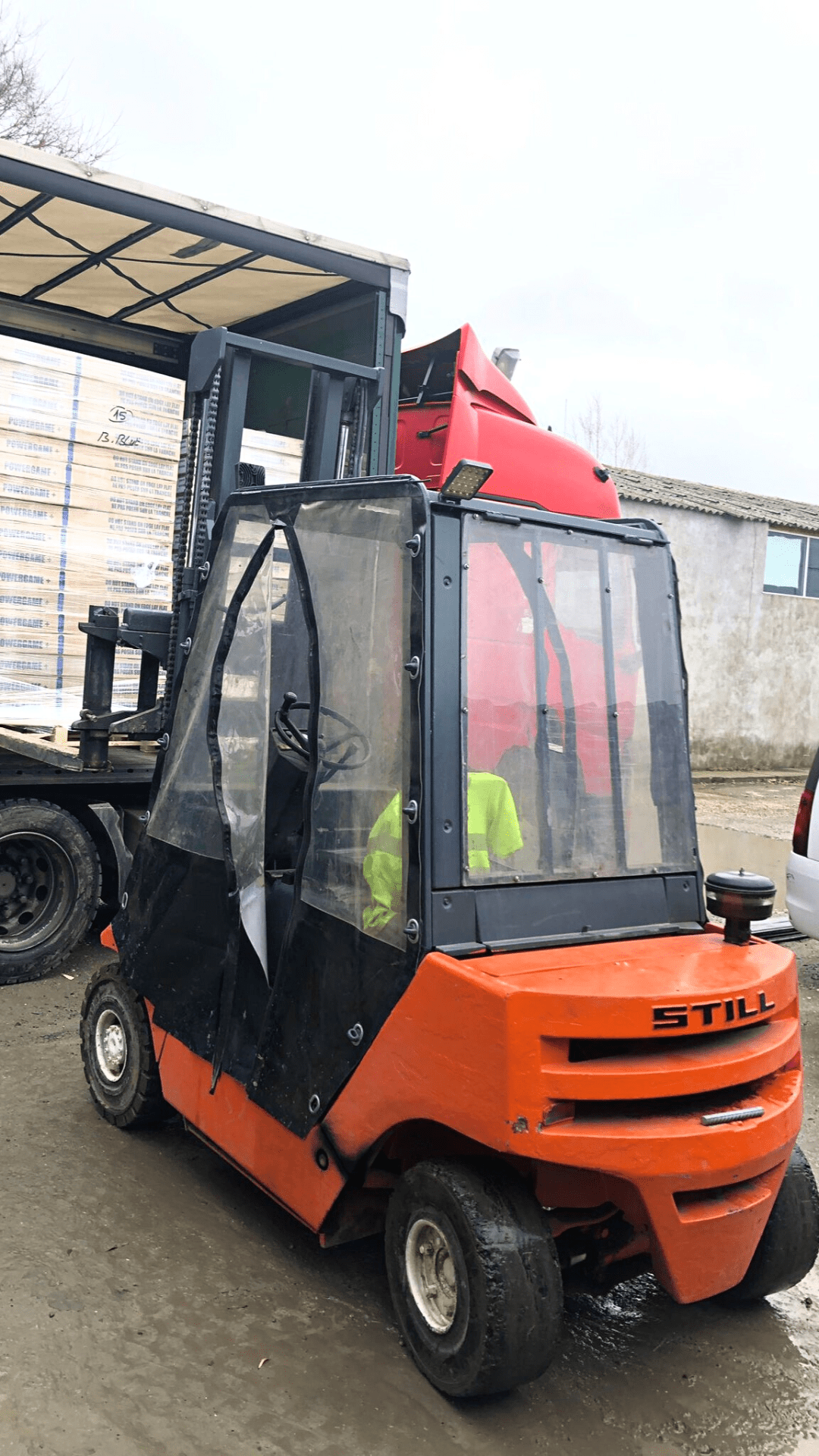 Unloading Pallets from a Curtain Trailer using a Forklift